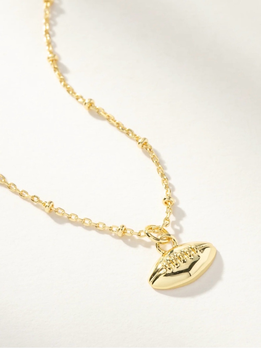 Uncommon James Gold Football Pendant Necklace